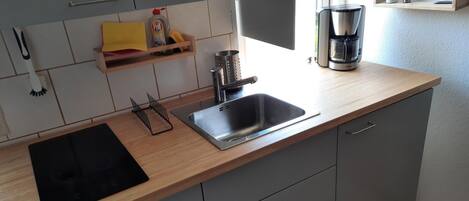 Fridge, stovetop, electric kettle, toaster