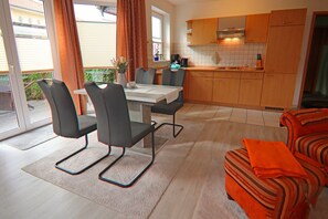 Cozy living space with a dining area, kitchenette, and comfortable seating.