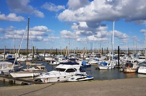 Boats dock at the marina, offering serene views of the surrounding water.