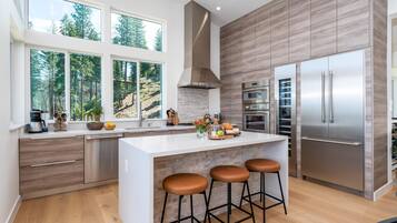 Dishwasher, paper towels, dining tables, kitchen islands