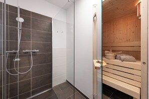 Shower, hair dryer, towels, soap