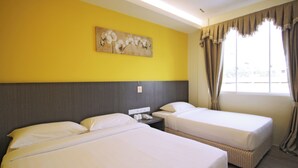 A hotel room with two beds, a nightstand with a phone, and a window with curtains. - Signature Inn (Kota Kinabalu)