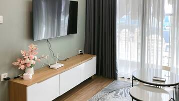 Luxury Apartment, Balcony, City View | Living area | 52-inch flat-screen TV with cable channels, Netflix, streaming services
