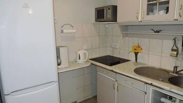 Fridge, microwave, stovetop, coffee/tea maker