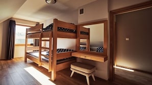 A bunk bed room with a desk and a small stool. - holiday home directly at the lake, Dabie (Dabie)
