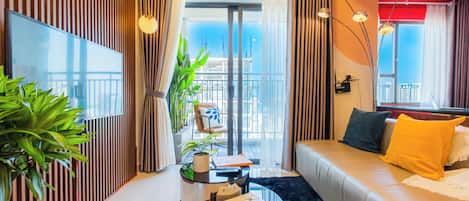 Deluxe Apartment, 2 Bedrooms, Kitchen, City View | Living area | Flat-screen TV