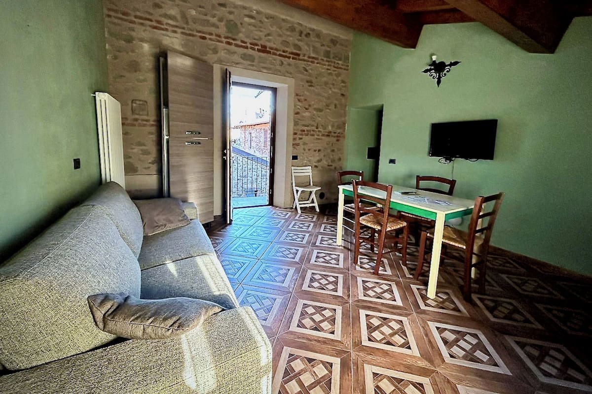 Classic Apartment | Living area | 36-inch flat-screen TV with satellite channels