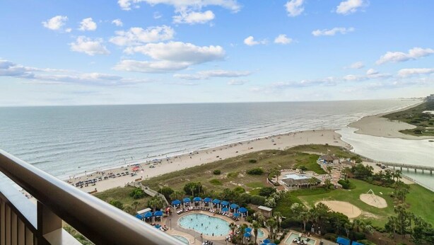 A beach resort with a swimming pool, beach area, and a pier. - Oceanfront Paradise Perfection 2BR Condo/ Balcony (North Myrtle Beach)