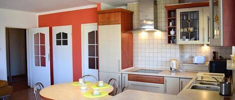 Fridge, microwave, stovetop, coffee/tea maker