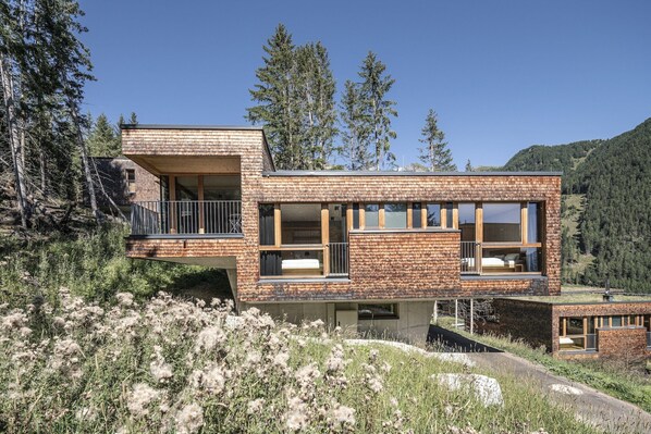 Experience the serene mountain setting from the expansive living area with panoramic views of the surrounding landscape.