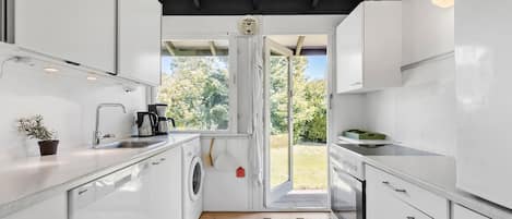 Fridge, stovetop, dishwasher, coffee/tea maker