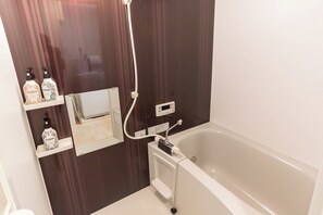 Comfort Apartment | Bathroom | Separate bathtub and shower, free toiletries, hair dryer, slippers