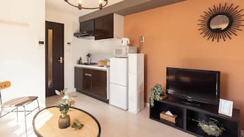 Comfort Apartment | Living area | 32-inch flat-screen TV with digital channels