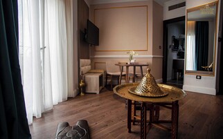 Signature Suite, Non Smoking, City View | Living area | 55-inch Smart TV with cable channels