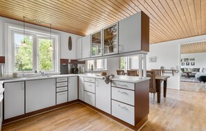 Fridge, stovetop, dishwasher, coffee/tea maker