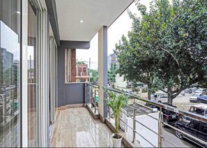 Family Room | Balcony - Bellmore Stay & Homes (Gurugram)