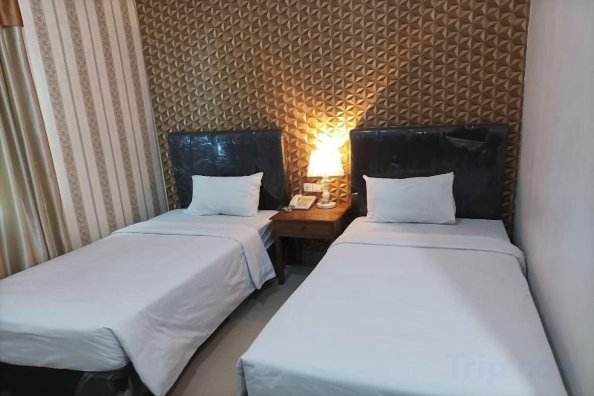 Desk, blackout curtains, free WiFi, bed sheets