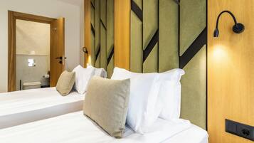 Family Quadruple Room, Balcony | In-room safe, laptop workspace, blackout drapes, iron/ironing board