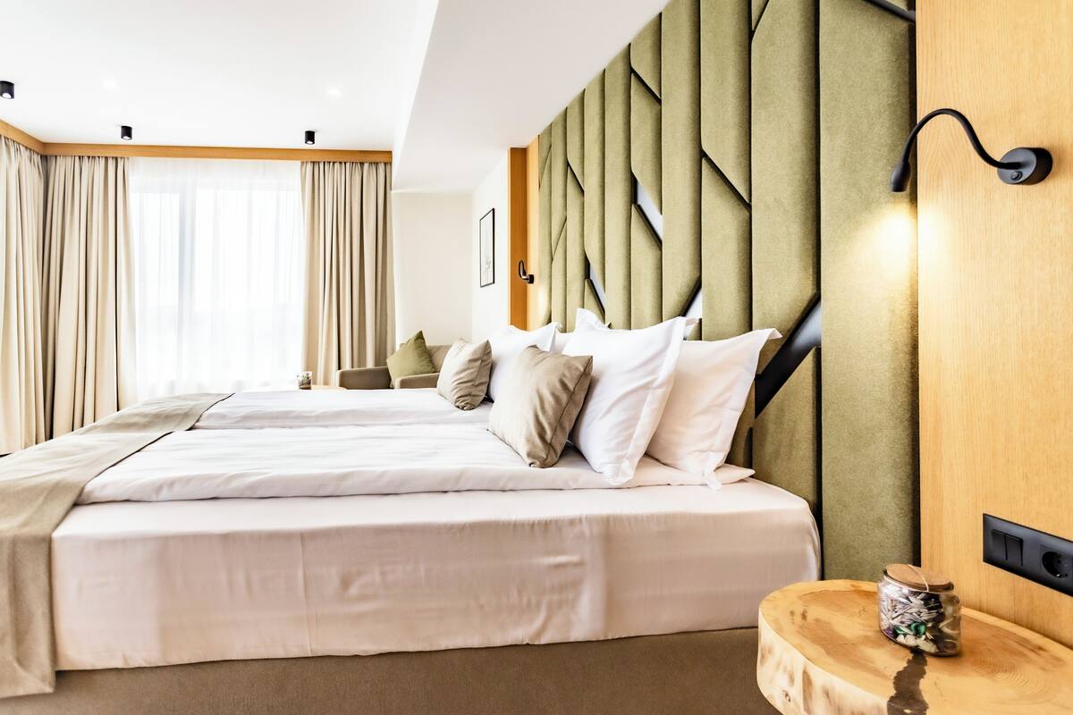 Deluxe Double Room, Balcony, Beach View | In-room safe, laptop workspace, blackout curtains
