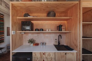 Fridge, coffee/tea maker, toaster, cookware/dishes/utensils