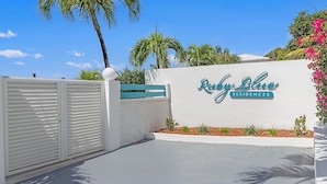 A gated entrance with a sign for Ruby Blue Residences.