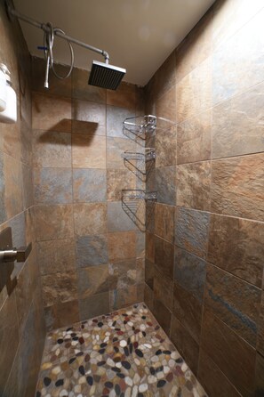 Shower, hair dryer, towels, shampoo