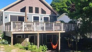 A two-story house with a balcony and a hammock. - Elberta Bluffs Cottage (Elberta)