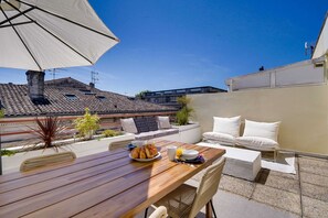 Enjoy breakfast on the rooftop with a view of the surrounding residential area.
