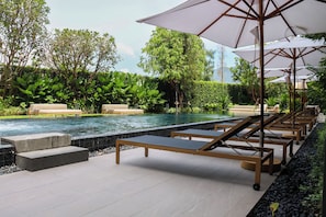 Outdoor pool, pool umbrellas, sun loungers