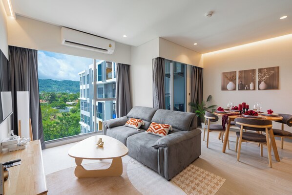 Premier Apartment, Lake View | Living area | 55-inch Smart TV with digital channels