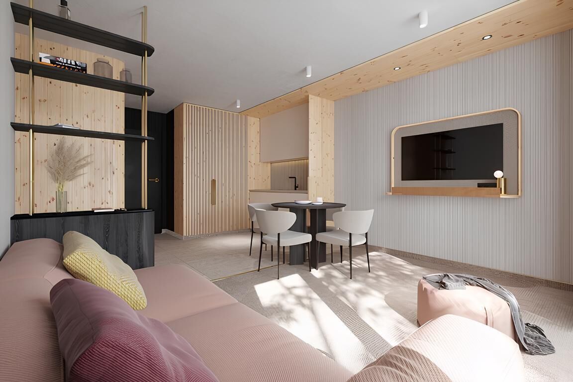 Una sala de estar moderna con un sofá, un comedor con sillas, una cocina con pileta y un espejo grande en la pared.