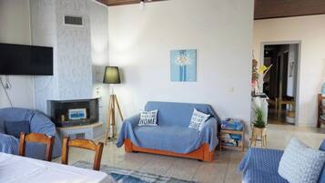 Family House, Multiple Bedrooms, 2 Bathrooms (Captain's Spacious House Near The) | Living area | Fireplace