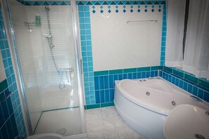 Shower, jetted tub, hair dryer, bidet