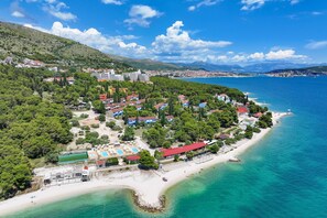 On the beach, sun loungers - Apartments Medena in Seget Donji Trogir with pools (Trogir - Seget Donij)
