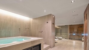 A modern bathroom with a large bathtub, a shower area, and a vanity with a mirror. - Modern apt High Ceilings, BBQ - Morph 401 (Medellín)