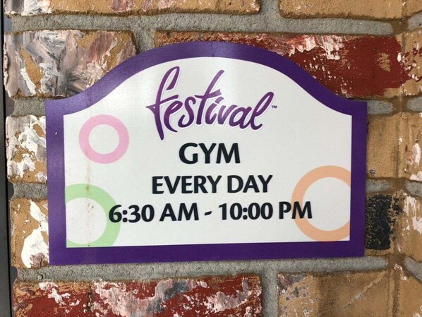 A sign for a gym with the text 'festival Gym Every Day 6:30 AM - 10:00 PM.' - Last Minute Disney Getaway! Townhouse with Private Pool. Book Now! #65725 (Orlando)