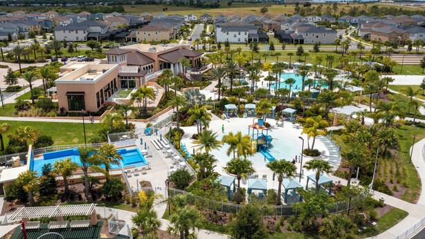 A residential area with houses, a swimming pool, and a park.