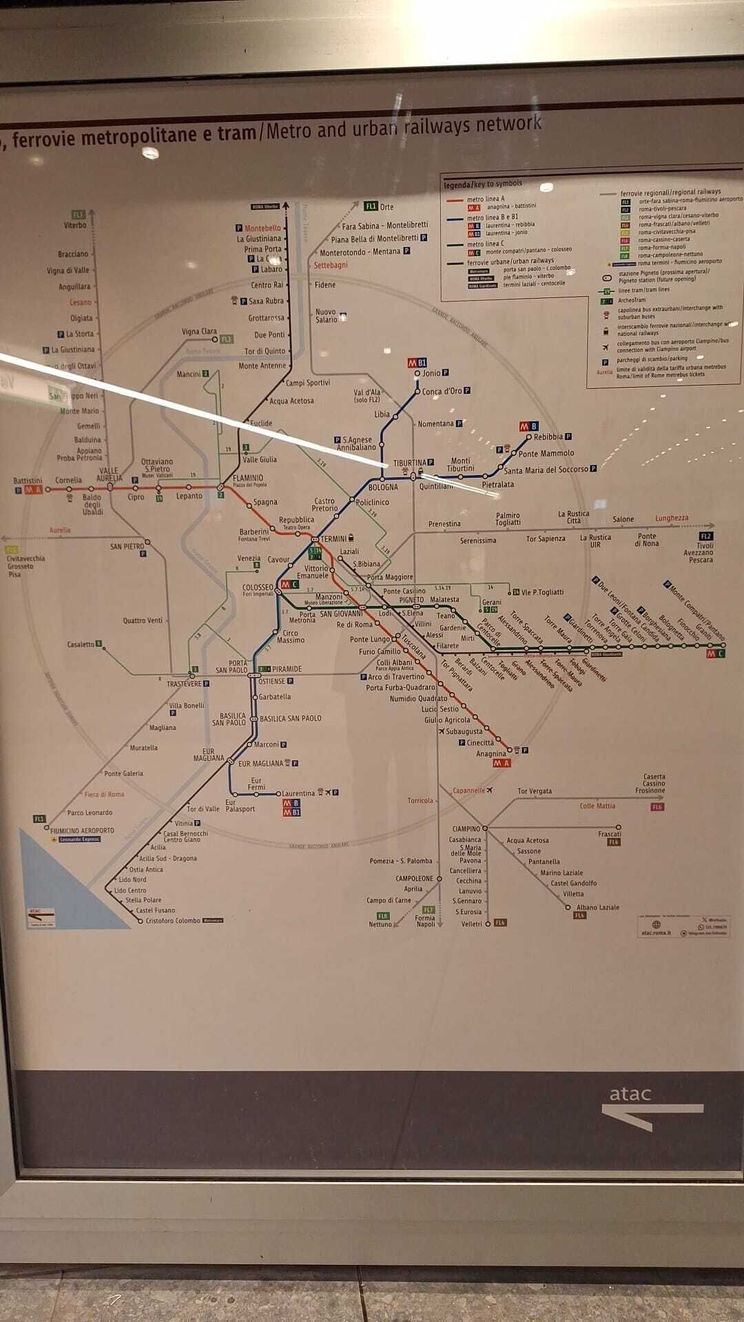 A detailed map of the metro and urban railways network in Rome, including lines M1, M2, M3, M4, and M5, with key symbols for metro lines, regional railways, and other transportation options.