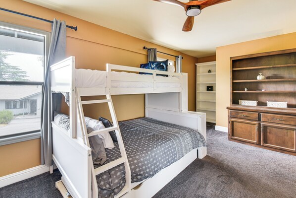 A bunk bed with a ladder, a wooden cabinet, and a window with curtains. - Yosemite Wellbeing Retreat on 5 Acres w/ Mtn Views (Ahwahnee)