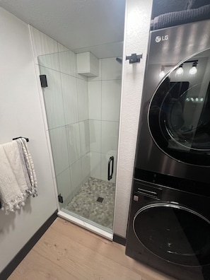 Shower, hair dryer, towels, soap