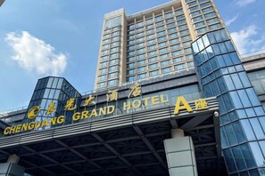 A hotel with a modern facade, large windows, and a prominent sign for the Chengdu Grand Hotel. - Chenguang Hotel (Xingtai)