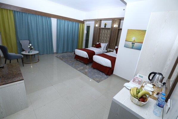 Habitación Deluxe | Ropa de cama hipoalergénica, escritorio, tabla de planchar con plancha