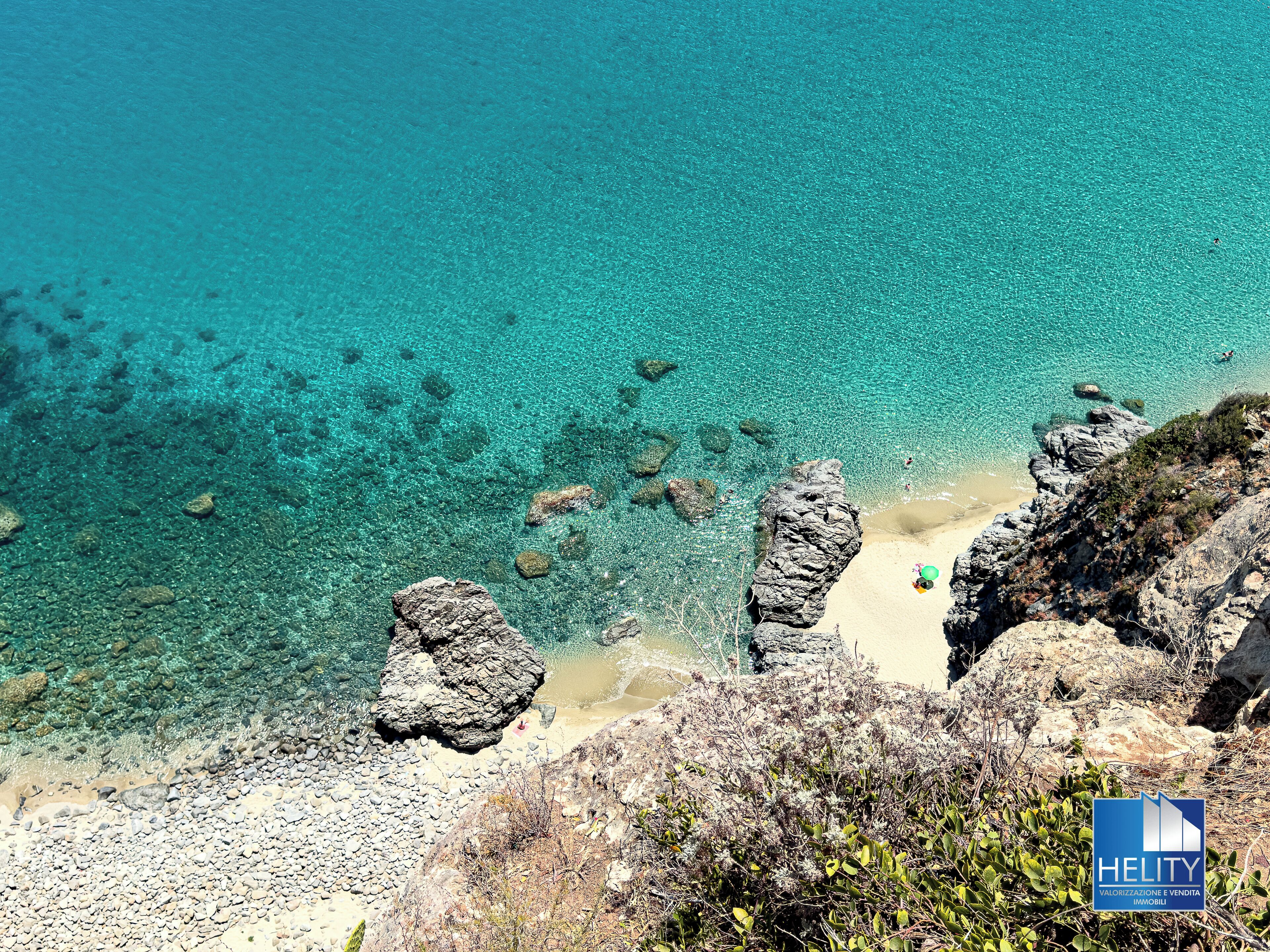 On the beach, sun-loungers