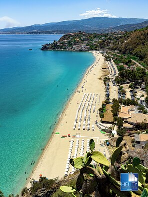 On the beach, sun-loungers