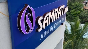 A sign for a hotel named "SAMRATN" with a logo and the text "A Unit By Everest Inn". - Samrat Inn (Pune)