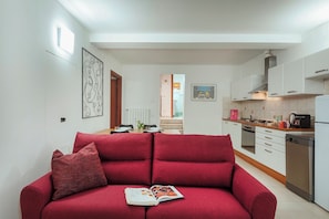 Apartment | Living area | 35-inch TV with digital channels - Casana Downtown by Wonderful Italy (Genoa)