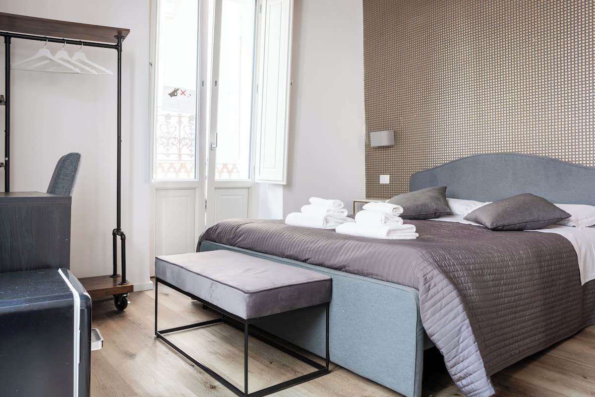 Habitación exclusiva, vista a la ciudad | Insonorización, tabla de planchar con plancha y wifi gratis
