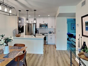 Enjoy cooking in this well-equipped kitchen with a dining area and island.