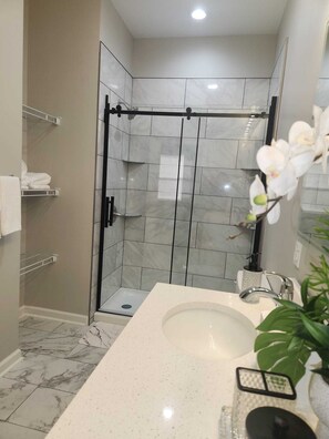 Shower, hair dryer, towels, soap