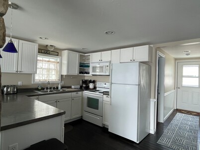 Cozy lakefront home on Ossipee Lake, w/beach, dock and amazing view.